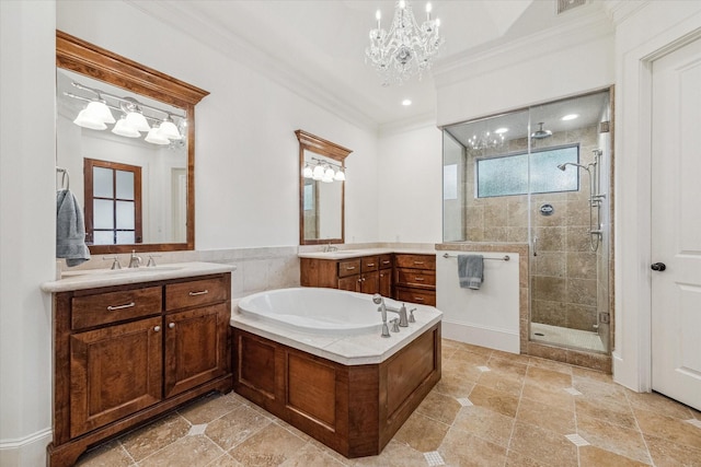 5418 Braeburn Dr, Bellaire, TX 77401 - full bath with crown molding, a chandelier, a stall shower, two vanities, and a garden tub