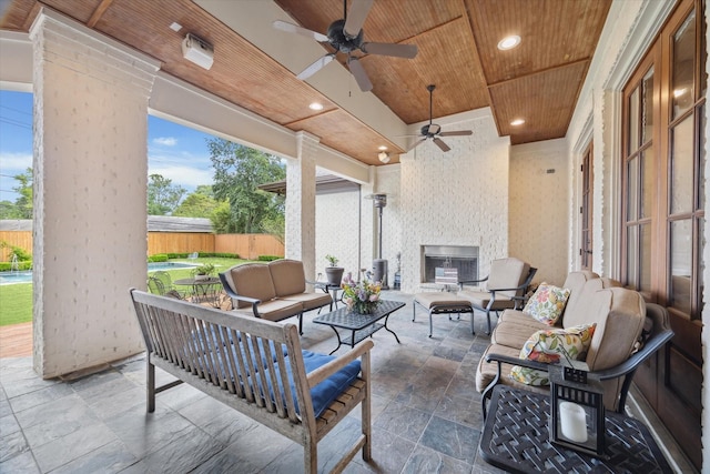 5418 Braeburn Dr, Bellaire, TX 77401 - view of patio with an outdoor living space with a fireplace and a ceiling fan