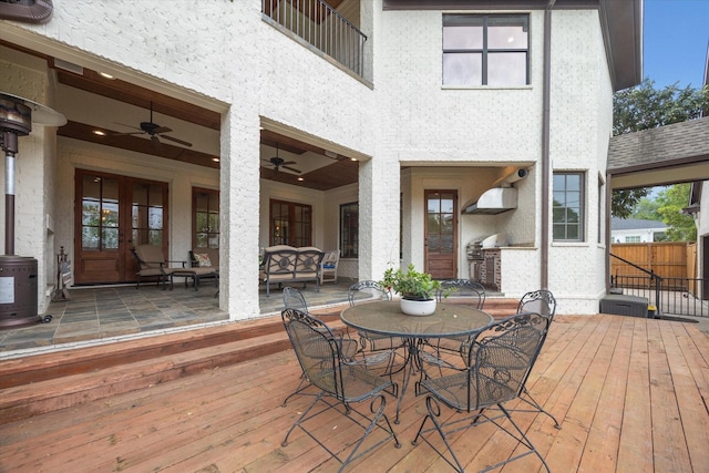 5418 Braeburn Dr, Bellaire, TX 77401 - deck featuring a ceiling fan, outdoor dining space, area for grilling, and an outdoor hangout area