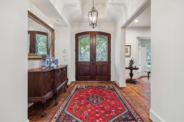 5418 Braeburn Dr, Bellaire, TX 77401 - foyer with wood finished floors, a chandelier, crown molding, french doors, and baseboards