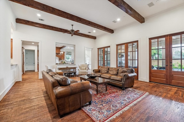 5418 Braeburn Dr, Bellaire, TX 77401 - living room with french doors, beam ceiling, wood finished floors, a ceiling fan, and recessed lighting