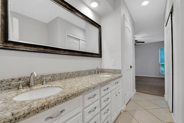 35 Greentree Ln, Conroe, TX 77304 - full bath with double vanity, tile patterned flooring, baseboards, and recessed lighting