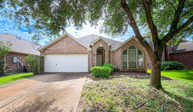 3218 Travis Creek Way, Fresno, TX 77545 - traditional-style home featuring an attached garage, driveway, brick siding, and a shingled roof