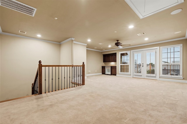 2403 Commonwealth St, Houston, TX 77006 - unfurnished living room featuring attic access, ornamental molding, recessed lighting, light carpet, and baseboards