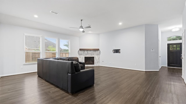 18010 Wagstaff Way, Richmond, TX 77407 - living room featuring a ceiling fan, dark wood finished floors, a stone fireplace, baseboards, and recessed lighting