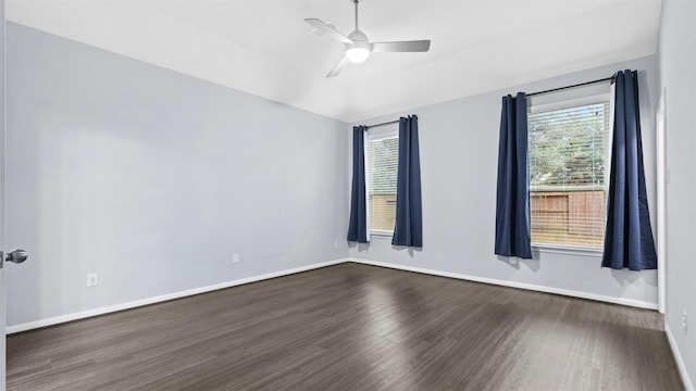 18010 Wagstaff Way, Richmond, TX 77407 - spare room featuring dark wood-style floors, healthy amount of natural light, ceiling fan, baseboards, and vaulted ceiling