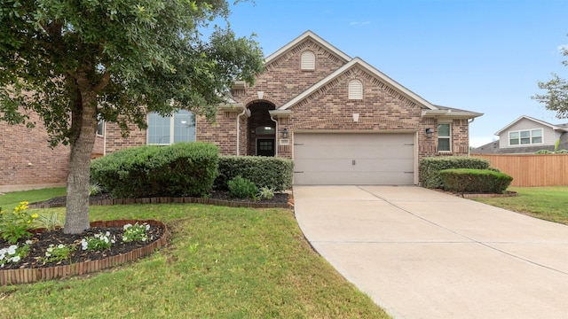 18010 Wagstaff Way, Richmond, TX 77407 - view of front of property featuring an attached garage, driveway, and brick siding