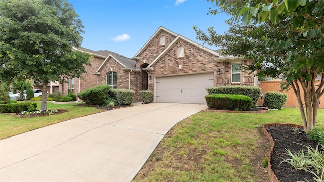 18010 Wagstaff Way, Richmond, TX 77407 - traditional-style house featuring an attached garage, brick siding, and concrete driveway