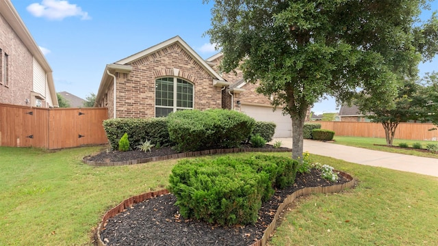 18010 Wagstaff Way, Richmond, TX 77407 - view of front of property with brick siding, concrete driveway, and a garage