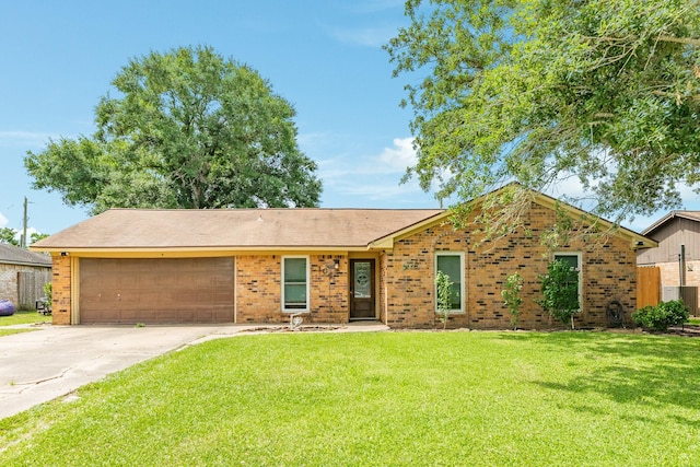 104 Meadowlark Ln, Angleton, TX 77515 - view of front of house featuring an attached garage, concrete driveway, brick siding, and central AC unit