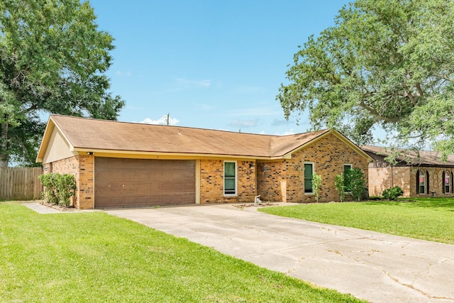 104 Meadowlark Ln, Angleton, TX 77515 - ranch-style house with an attached garage, driveway, and brick siding