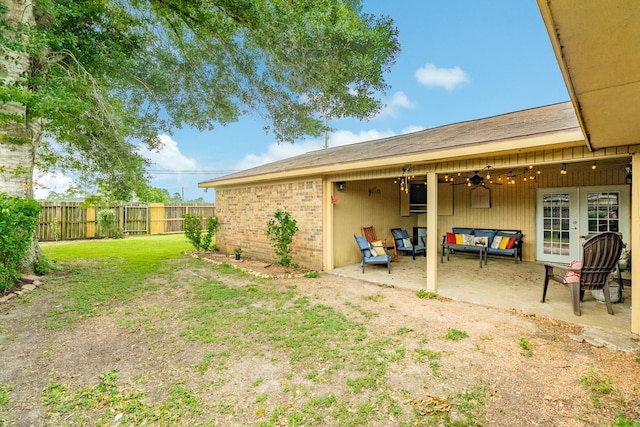 104 Meadowlark Ln, Angleton, TX 77515 - view of yard with a patio, ceiling fan, french doors, and an outdoor living space