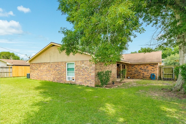 104 Meadowlark Ln, Angleton, TX 77515 - back of property with brick siding and cooling unit