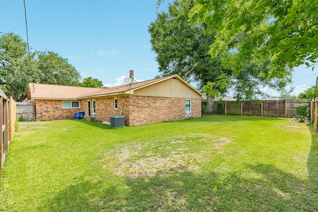 104 Meadowlark Ln, Angleton, TX 77515 - back of property with central air condition unit and brick siding