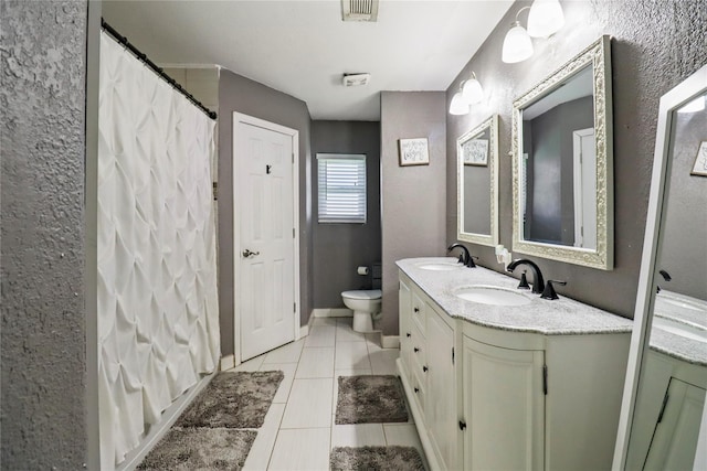 104 Meadowlark Ln, Angleton, TX 77515 - bathroom with double vanity, tile patterned flooring, toilet, and a shower with shower curtain