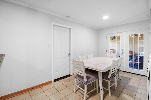 104 Meadowlark Ln, Angleton, TX 77515 - dining area featuring french doors, ornamental molding, light tile patterned floors, recessed lighting, and baseboards