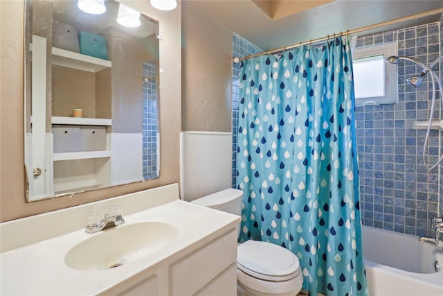 104 Meadowlark Ln, Angleton, TX 77515 - bathroom with shower / bath combo with shower curtain, toilet, vanity, and a wainscoted wall