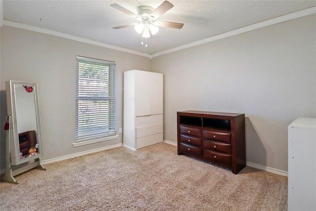 104 Meadowlark Ln, Angleton, TX 77515 - unfurnished bedroom with ornamental molding, carpet flooring, a textured ceiling, ceiling fan, and baseboards