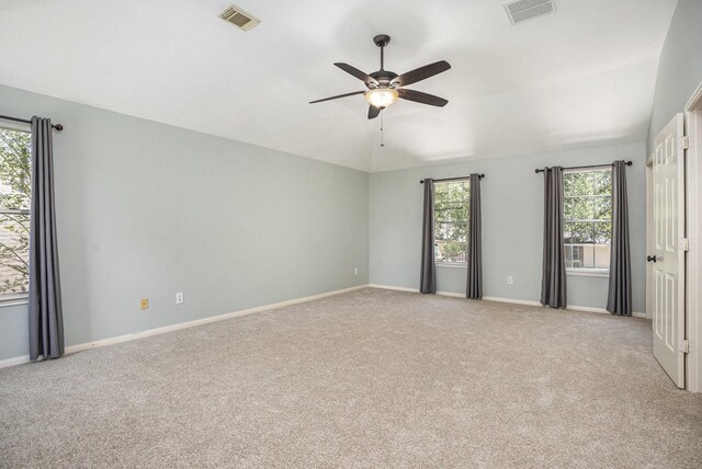 311 Vantage Pointe Cir, League City, TX 77573 - unfurnished bedroom featuring carpet floors, multiple windows, baseboards, and ceiling fan