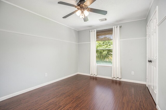 311 Vantage Pointe Cir, League City, TX 77573 - unfurnished room featuring dark wood finished floors, a ceiling fan, baseboards, and crown molding