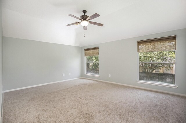 311 Vantage Pointe Cir, League City, TX 77573 - carpeted empty room featuring vaulted ceiling, ceiling fan, and baseboards