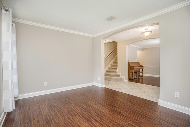 311 Vantage Pointe Cir, League City, TX 77573 - unfurnished room with stairs, ornamental molding, wood finished floors, and baseboards