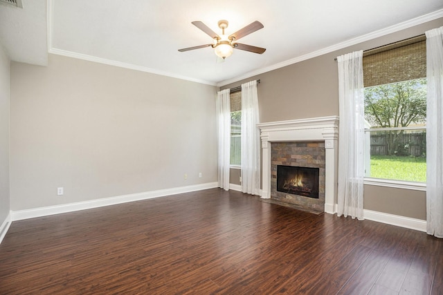 311 Vantage Pointe Cir, League City, TX 77573 - unfurnished living room with dark wood-style flooring, ceiling fan, baseboards, a fireplace with flush hearth, and crown molding