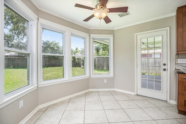 311 Vantage Pointe Cir, League City, TX 77573 - unfurnished sunroom with tile patterned flooring, baseboards, and crown molding