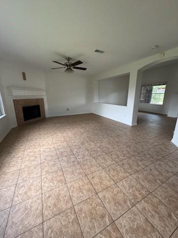 25227 Twister Trl, Spring, TX 77373 - unfurnished living room with ceiling fan and a fireplace