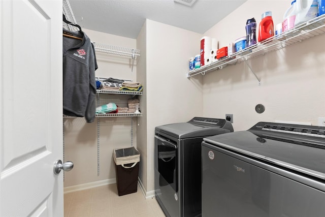 3803 Shiloh Park Ct, Friendswood, TX 77546 - laundry area featuring washing machine and clothes dryer and baseboards