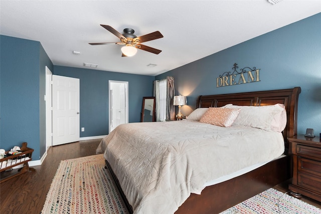 3803 Shiloh Park Ct, Friendswood, TX 77546 - bedroom with wood finished floors, baseboards, ceiling fan, and ensuite bath