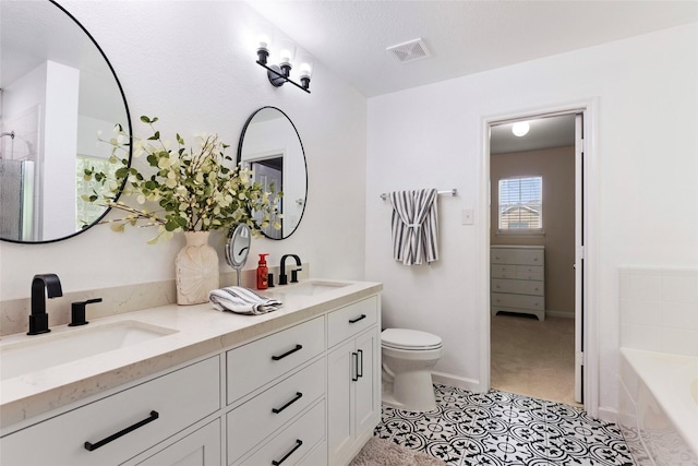 3803 Shiloh Park Ct, Friendswood, TX 77546 - bathroom featuring double vanity, a bath, toilet, tile patterned floors, and baseboards