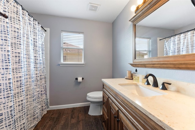 3803 Shiloh Park Ct, Friendswood, TX 77546 - bathroom featuring vanity, wood finished floors, toilet, baseboards, and a shower with shower curtain