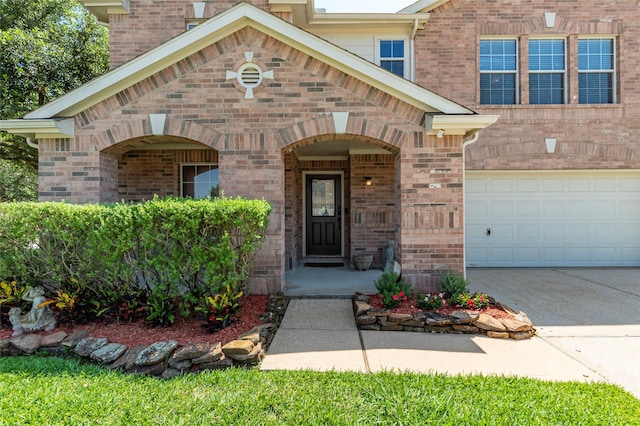 3803 Shiloh Park Ct, Friendswood, TX 77546 - view of exterior entry featuring an attached garage, brick siding, and driveway