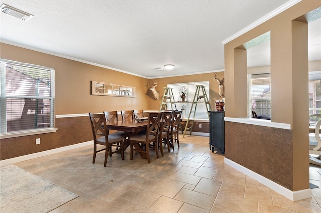 3803 Shiloh Park Ct, Friendswood, TX 77546 - dining space with baseboards, ornamental molding, and a textured ceiling