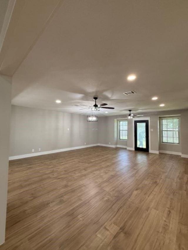 674 Meadowgreen Dr, Port Neches, TX 77651 - unfurnished room with wood finished floors, recessed lighting, baseboards, healthy amount of natural light, and a ceiling fan