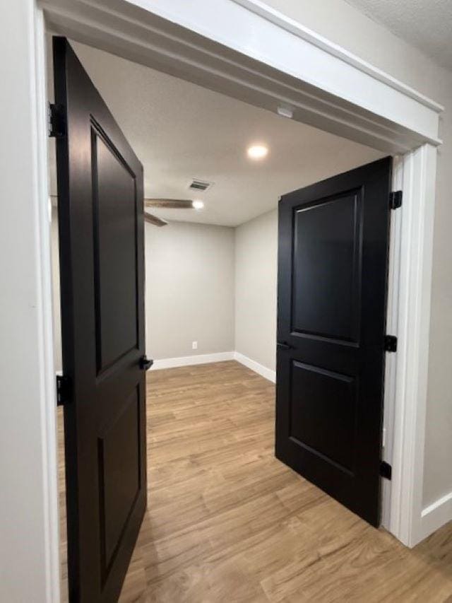 674 Meadowgreen Dr, Port Neches, TX 77651 - corridor with baseboards, light wood-type flooring, and recessed lighting