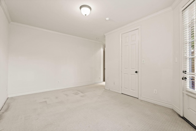 9269 Buffalo Speedway, Houston, TX 77025 - empty room featuring crown molding, light carpet, and baseboards