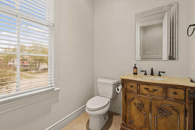 9269 Buffalo Speedway, Houston, TX 77025 - half bath featuring vanity, toilet, and baseboards