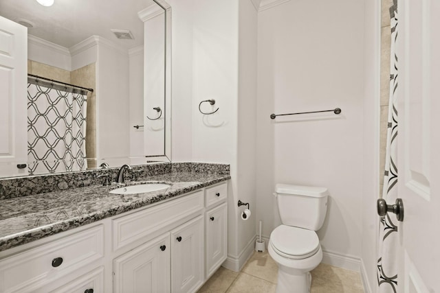 9269 Buffalo Speedway, Houston, TX 77025 - bathroom featuring vanity, toilet, crown molding, tile patterned flooring, and baseboards