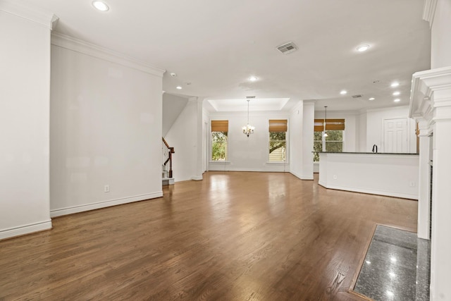 9269 Buffalo Speedway, Houston, TX 77025 - unfurnished living room with recessed lighting, ornamental molding, wood finished floors, stairs, and baseboards