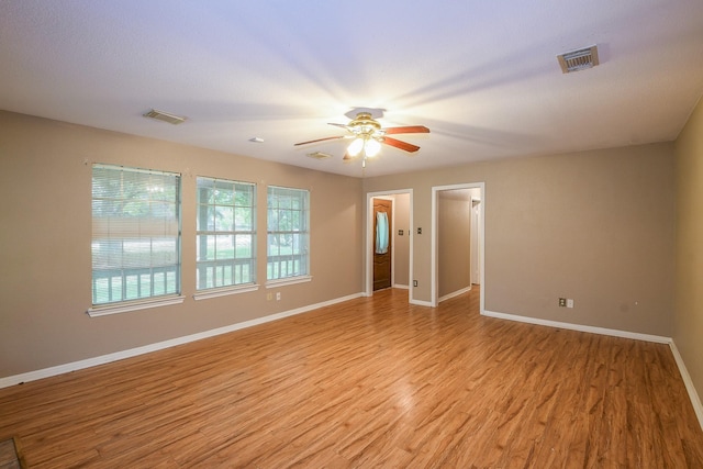1083 County Rd 147, Alvin, TX 77511 - spare room with ceiling fan, light wood-style flooring, and baseboards