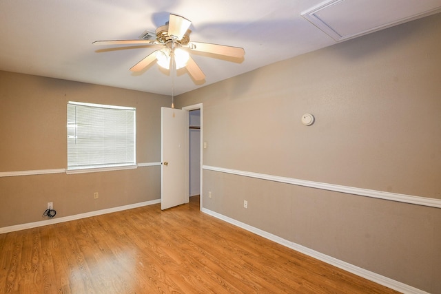 1083 County Rd 147, Alvin, TX 77511 - spare room featuring wood finished floors, a ceiling fan, and baseboards