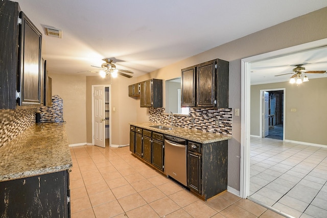 1083 County Rd 147, Alvin, TX 77511 - kitchen featuring ceiling fan, stainless steel dishwasher, a sink, light tile patterned flooring, and tasteful backsplash