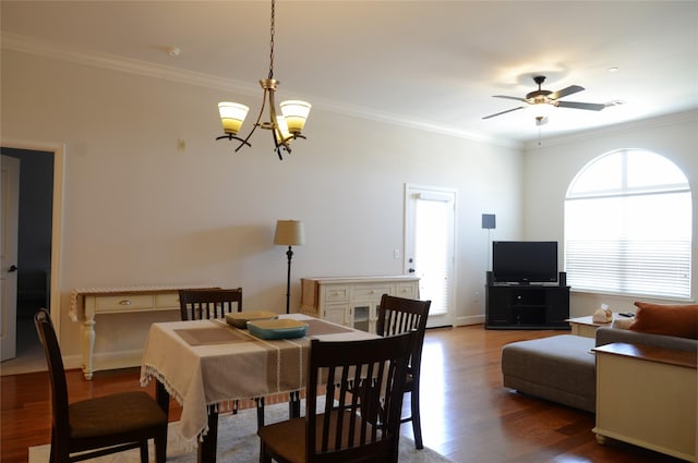 2203 Dorrington St Unit 403, Houston, TX 77030 - dining room with wood finished floors, ornamental molding, ceiling fan, a chandelier, and baseboards