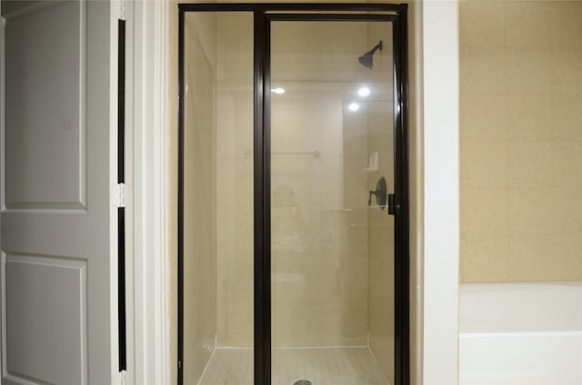 2203 Dorrington St Unit 403, Houston, TX 77030 - bathroom with a stall shower and a bath
