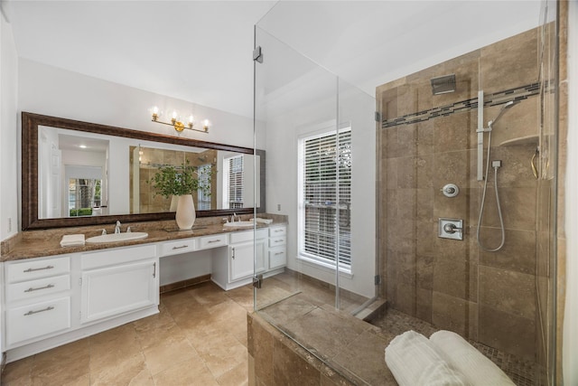 10310 Minturn Ln, Houston, TX 77064 - bathroom featuring double vanity, tiled shower, a chandelier, and plenty of natural light