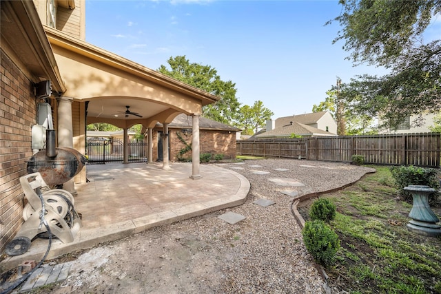 10310 Minturn Ln, Houston, TX 77064 - fenced backyard featuring a ceiling fan and a patio area