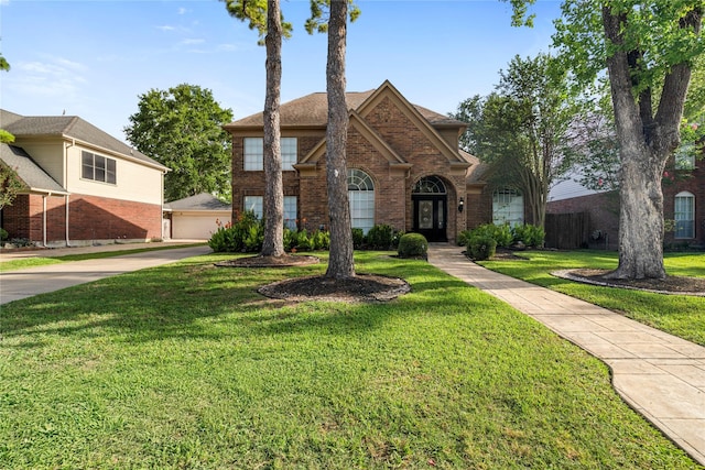 10310 Minturn Ln, Houston, TX 77064 - view of front of property featuring brick siding and a front lawn