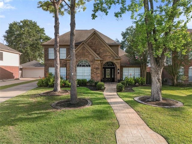10310 Minturn Ln, Houston, TX 77064 - traditional home with brick siding, a front yard, and a shingled roof